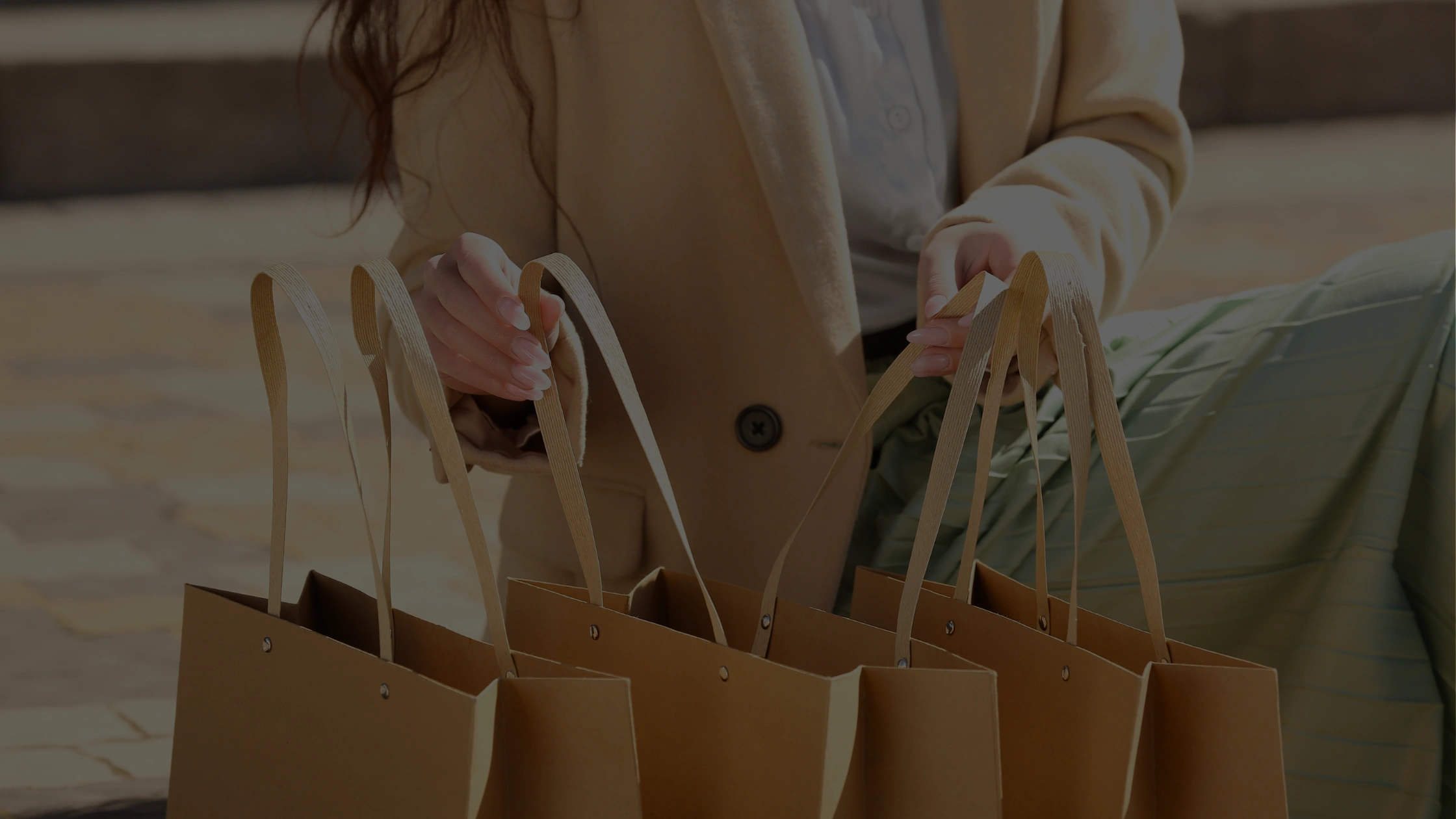 Person carrying multiple shopping bags